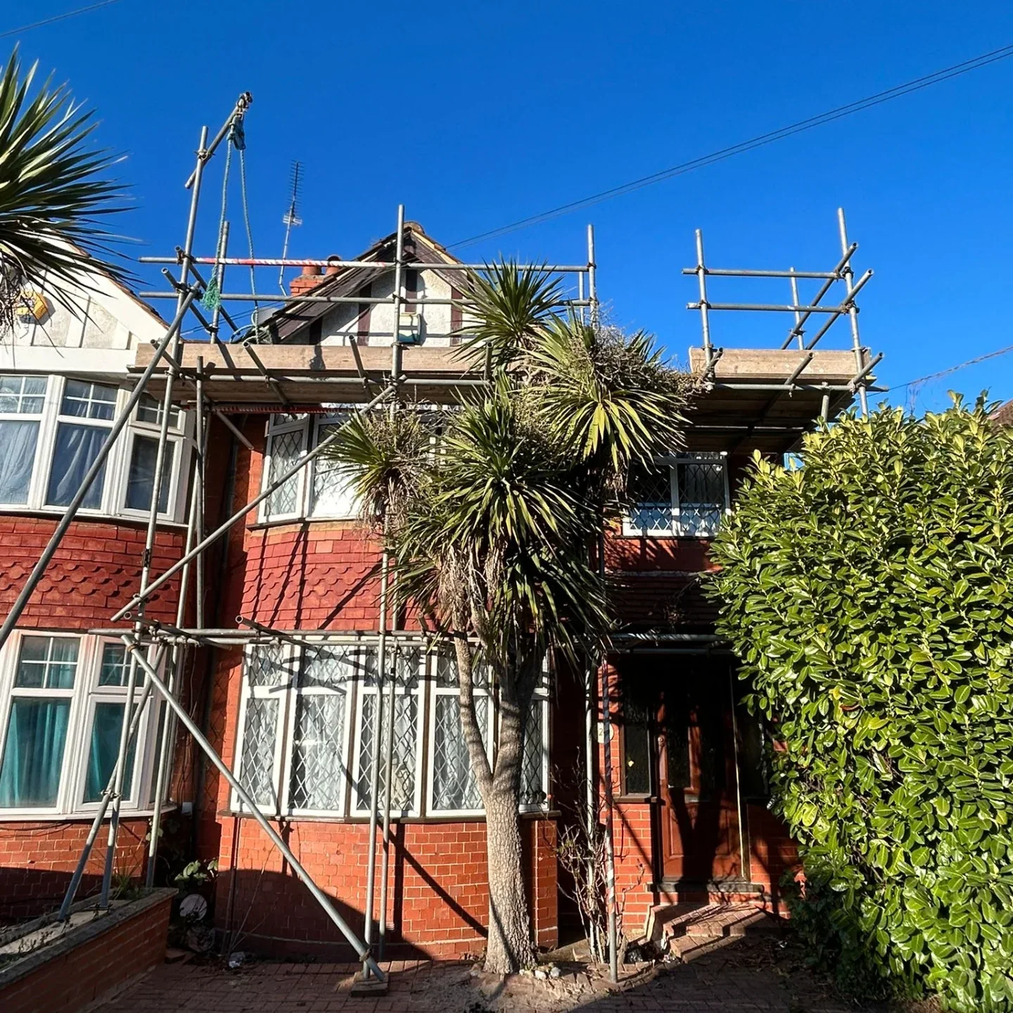 Scaffolding erected at a red-brick house